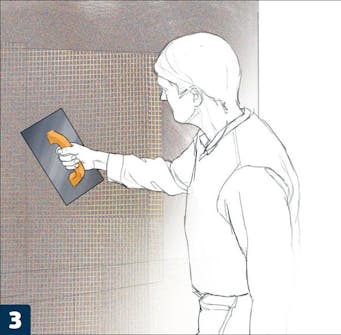 Kingspan isolering: Armeringsnätet trycks in i bruket med stålbrädan Kingspan isolering: Armeringsnätet trycks in i bruket med stålbrädan